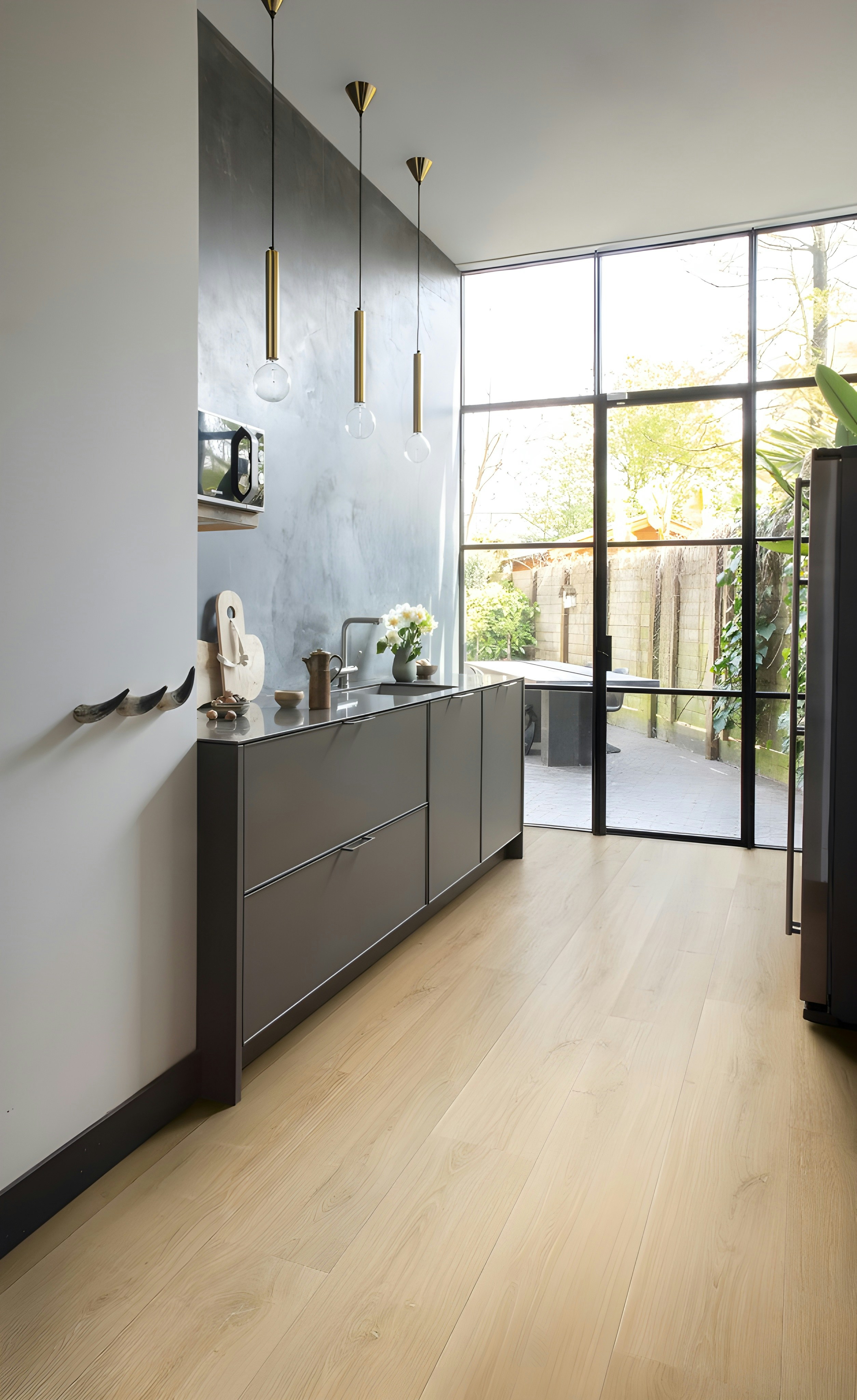 Stunning grey kitchen with glass doors fitted during HMO refurbishment